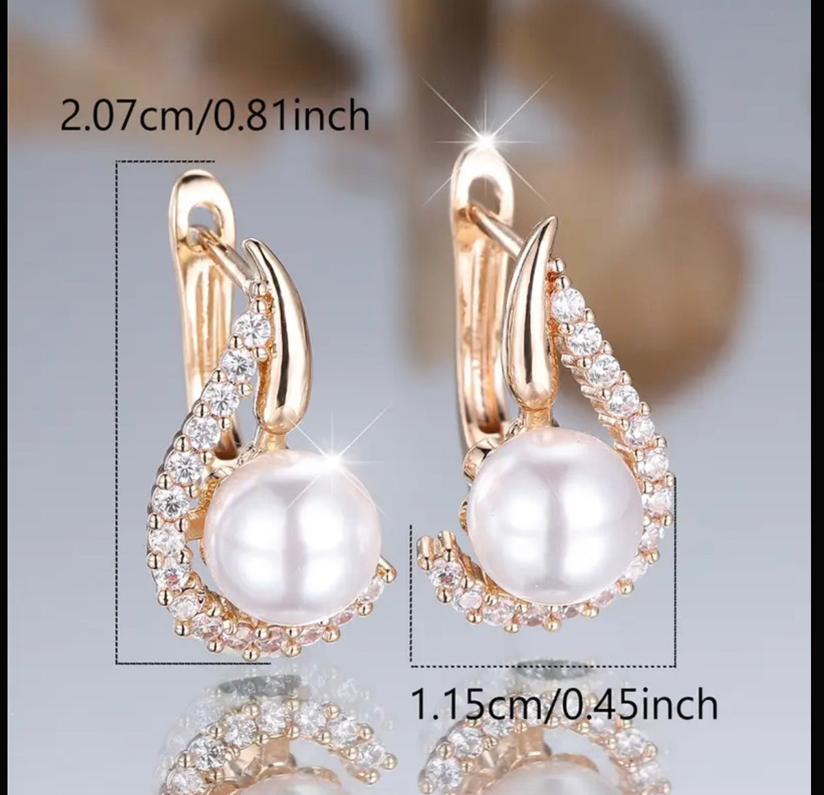 Ohrringe in Goldton mit Anhänger aus synthetischem Zirkon und Perlen